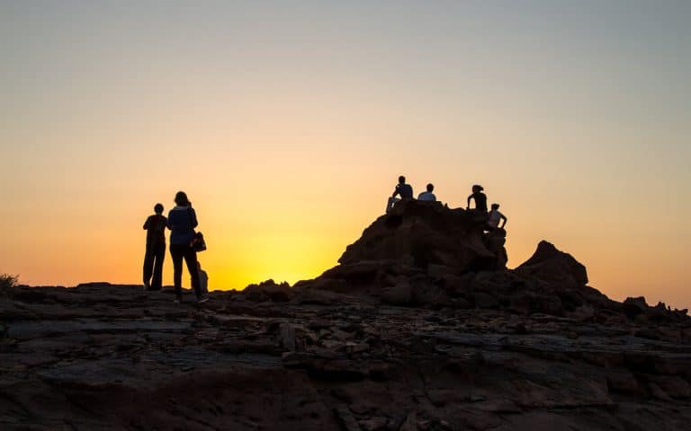 guests enjoying a magical sunset